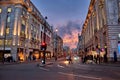 Urban view of London city near Piccadilly Circus with night traffic. Rush hour in London city against a cloudy sky at night Royalty Free Stock Photo