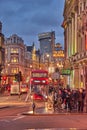 Urban view of London city near Piccadilly Circus with night traffic. Rush hour in London city against a cloudy sky at night Royalty Free Stock Photo