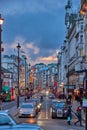 Urban view of London city near Piccadilly Circus with night traffic. Rush hour in London city against a cloudy sky at night Royalty Free Stock Photo