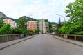 Urban views and decoration of the city Chiatura , Georgia. Blue sky with clouds. River and old houses Royalty Free Stock Photo