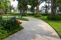 Urban walking road among green tree in modern apartment buildings in big city Royalty Free Stock Photo