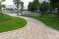 Urban walking road among green tree in modern apartment buildings in big city Royalty Free Stock Photo