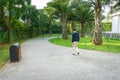 Urban walking road among green trees inside modern apartment building area in big city