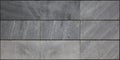 Urban wall horizontal grey tiles texture inside a building.