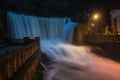 Urban waterfall at night in New Athos, Abkhazia. Long exposure shot. Blurred soft water