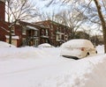 Urban winter street with cars stuck in snow