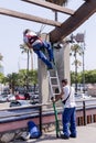 Urban workers spend repair work near the Olympic port