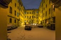 urban yard in St Petersburg city in night snowfall