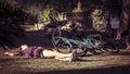 Young woman on bike is having a break