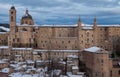 Urbino city during winter storm with snow