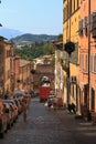 Urbino, Italy - August 9, 2017: A small street in the old town of Urbino. sunny day. Royalty Free Stock Photo