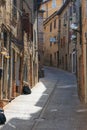 Urbino, Italy - August 9, 2017: A small street in the old town of Urbino. sunny day. Royalty Free Stock Photo