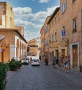 Urbino, Italy - August 9, 2017: A small street in the old town of Urbino. sunny day Royalty Free Stock Photo