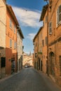 Urbino, Italy - August 9, 2017: A small street in the old town of Urbino. sunny day Royalty Free Stock Photo