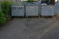 Large scale metal garbage containers in industrial zone in Urdorf.