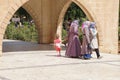 turkish women in scarves with their children in the park of Birket Ibrahim in southeastern Turkey