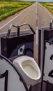 Urinal in the men's room in the form of a bicycle, handlebar and road to the field. Original bathroom design Royalty Free Stock Photo