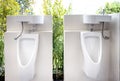 Urinals for men to urinate and hand washing point in the male toilet at park,white urinal with a sink on top of the urinal to