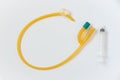 Foley catheter and syringe on white background Royalty Free Stock Photo