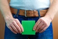 Urinary or prostate problems concept. Man holds sticker note near crotch.