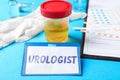 Urine sample and card with word UROLOGIST Royalty Free Stock Photo