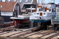 Urk, The Netherlands - June 22 2020: Three yachts for repair and maintenance in the dockyard of Urk, the Netherlands