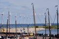 Urk, The Netherlands - June 15 2020 Windmills on the coast with trees, boat masts and people. Wind power and Green Royalty Free Stock Photo