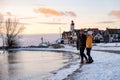 Urk Netherlands lighthouse during winter with snow covered coastline, Urk view at the lighthouse snowy landscape winter Royalty Free Stock Photo