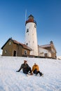 Urk Netherlands lighthouse during winter with snow covered coastline, Urk view at the lighthouse snowy landscape winter Royalty Free Stock Photo