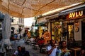 Urla, izmir, Turkey - June, 2023: Souvenir shops, cafes and people in Urla art street in izmir, Turkey.