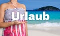 Urlaub (in german Holiday) concept is presented by woman on the