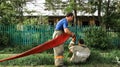 Urman, RUSSIA - 28 May 2011: two firefighters remove the red fire hose after extinguishing the fire, explosions and fires in