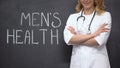 Urologist standing near Mens health words, medical exam to prevent prostatitis