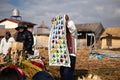 The Uros community showing off their handcrafts while tourists visit their floating island