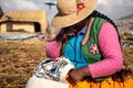 The Uros community showing off their handcrafts while tourists visit their floating island