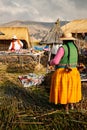 The Uros community showing off their handcrafts while tourists visit their floating island