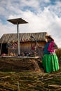 The Uros community showing off their handcrafts while tourists visit their floating island