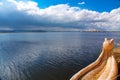 Uros floating island and Totora traditional boat on Titicaca lake, Puno city, Peru Royalty Free Stock Photo