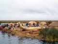 UROS ISLAND - LAKE TITICACA - PERU, January 3, 2007: Floating Uros Islands on Lake Titicaca. Unidentified Uros men and women Royalty Free Stock Photo