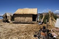 Uros, Peru Traditional Totora boat with tourists on Titicaca lake near to the Uros floating islands , Puno, Peru, Royalty Free Stock Photo