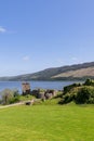 Historic Urquhart Castle ruin, vertical frame overlooking vast Loch Ness, Scotland Royalty Free Stock Photo