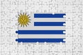 Uruguay flag in frame of white puzzle pieces with missing central part