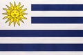 Uruguay national fabric flag, textile background. Symbol of international world south America country