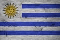 Uruguay national flag painted old oak wood