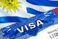 Uruguay Visa in passport. USA immigration Visa for Uruguay citizens focusing on word VISA. Travel Uruguay visa in national Royalty Free Stock Photo