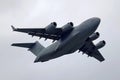 US Air Force Boeing C-17 Globemaster III performing low take-off and low pass fly by Royalty Free Stock Photo