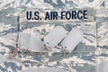 US AIR FORCE branch tape and dog tags on digital tiger-stripe pattern Airman Battle Uniform ABU Royalty Free Stock Photo