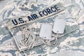 US AIR FORCE branch tape and dog tags on digital tiger-stripe pattern Airman Battle Uniform ABU Royalty Free Stock Photo