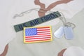 US AIR FORCE branch tape with dog tags and flag patch on desert camouflage uniform Royalty Free Stock Photo