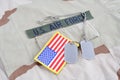 US AIR FORCE branch tape with dog tags and flag patch on desert camouflage uniform